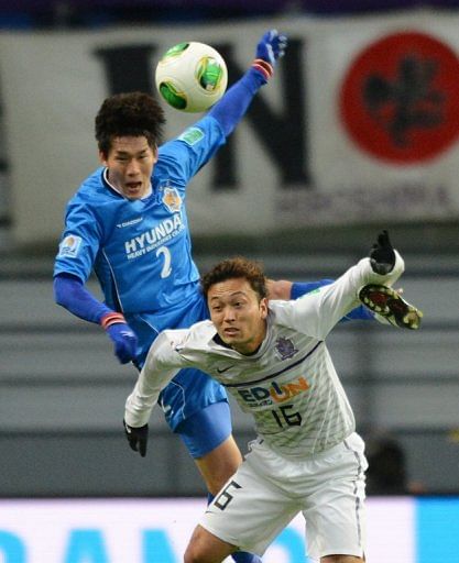 Satoru Yamagishi (below) and Lee Yong (top) both scored during Hiroshima's match against Ulsan Hyundai today